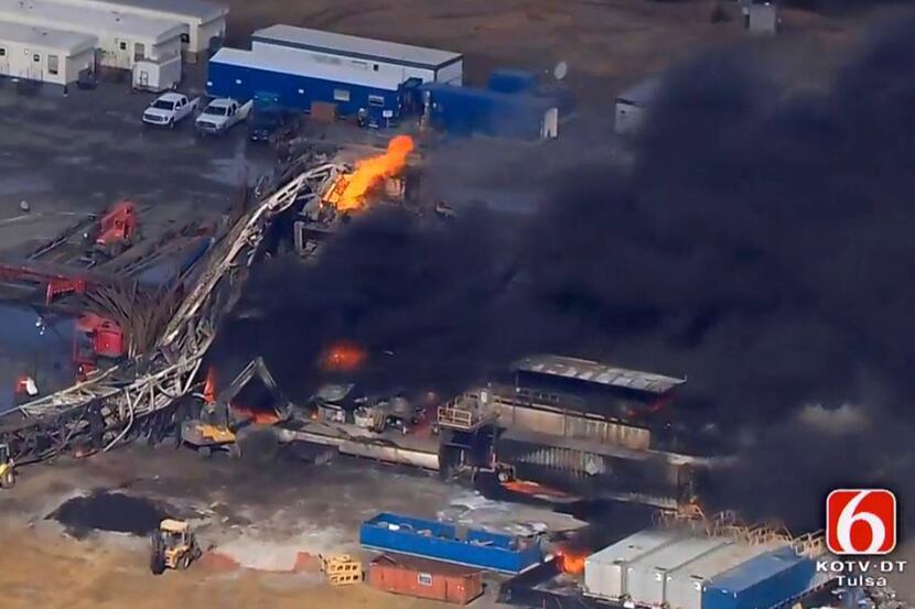 In this photo provided from a frame grab from Tulsa's KOTV/NewsOn6.com, fires burn at an...