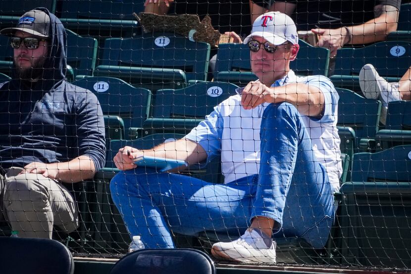 Texas Rangers executive vice president & general manager Chris Young watches from the stands...