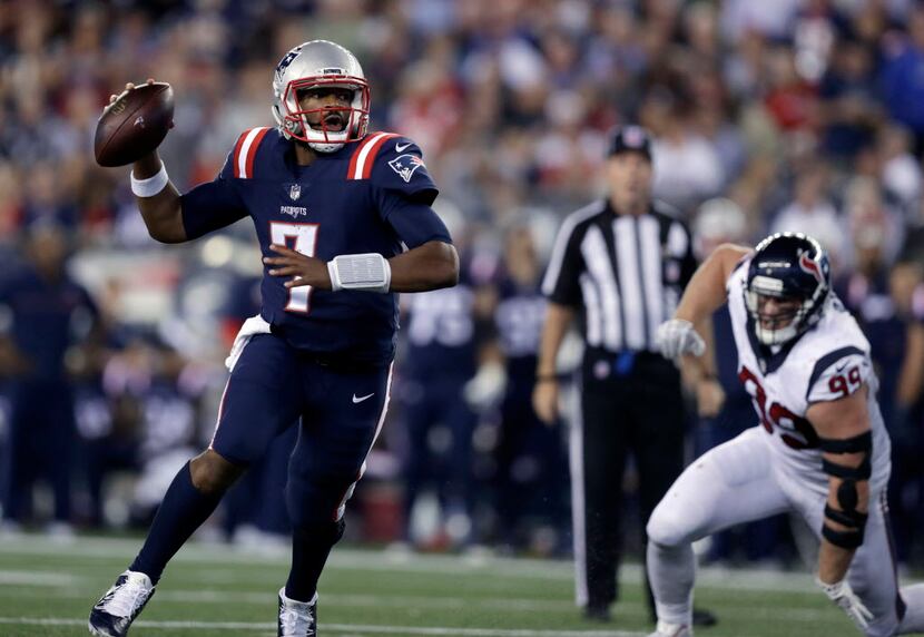 New England Patriots quarterback Jacoby Brissett (7) scrambles away from Houston Texans...