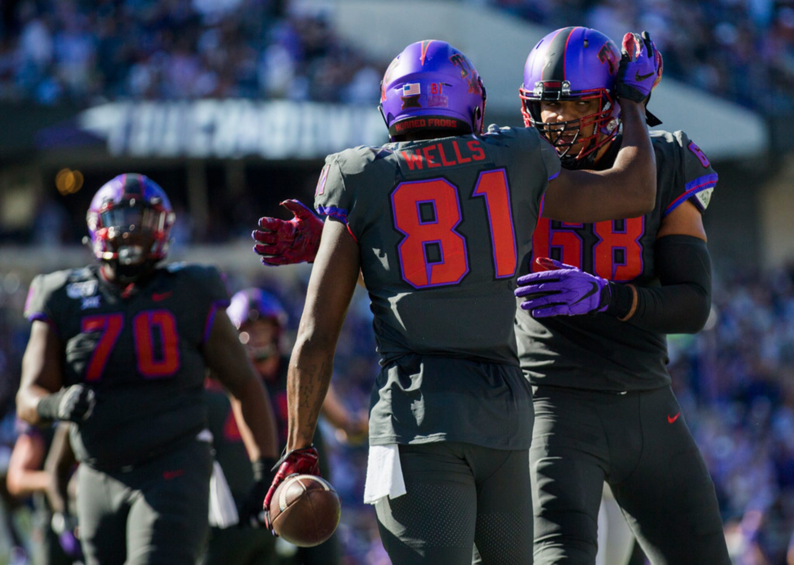 TCU Horned Frogs tight end Pro Wells (81) celebrates a touchdown with offensive tackle...