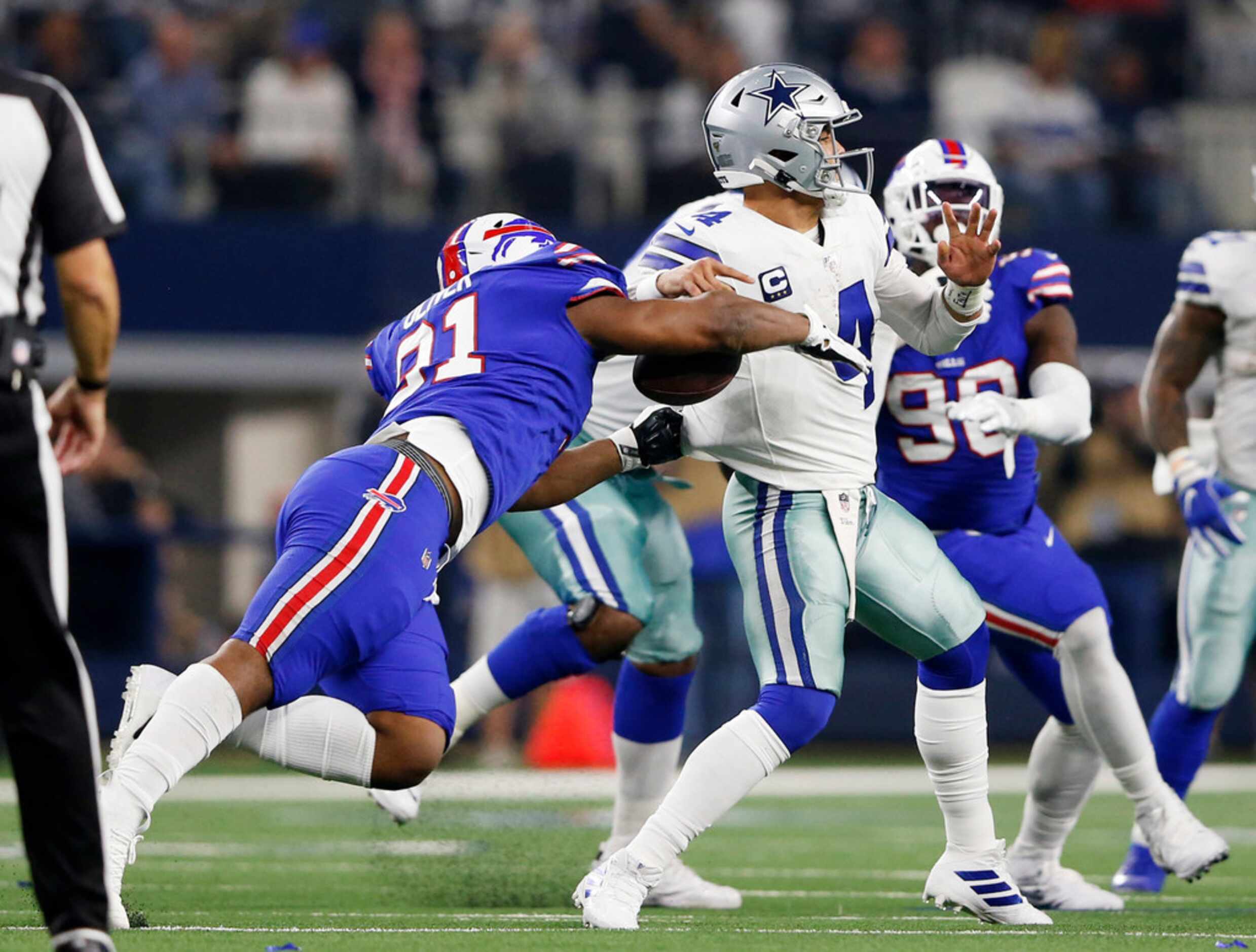 Buffalo Bills defensive tackle Ed Oliver (91) strips the ball away from Dallas Cowboys...
