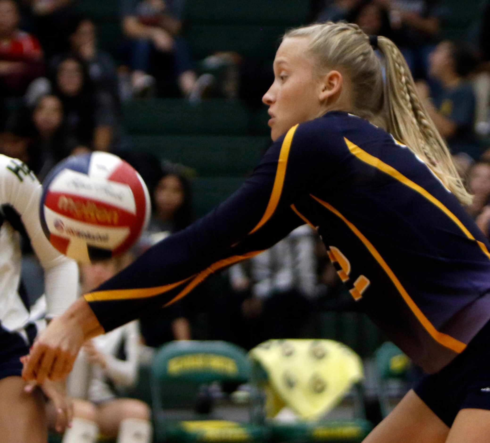 Highland Park outside hitter Kennedy Westendorff (22) sets a teammate during the second game...