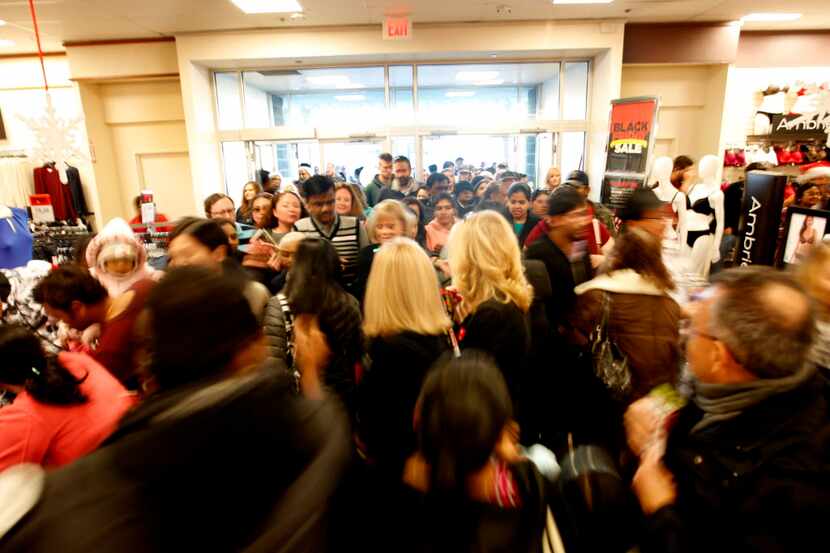 A crowd stampedes inside JCPenney at Stonebriar Centre Thanksgiving Day on Nov. 27, 2014 in...