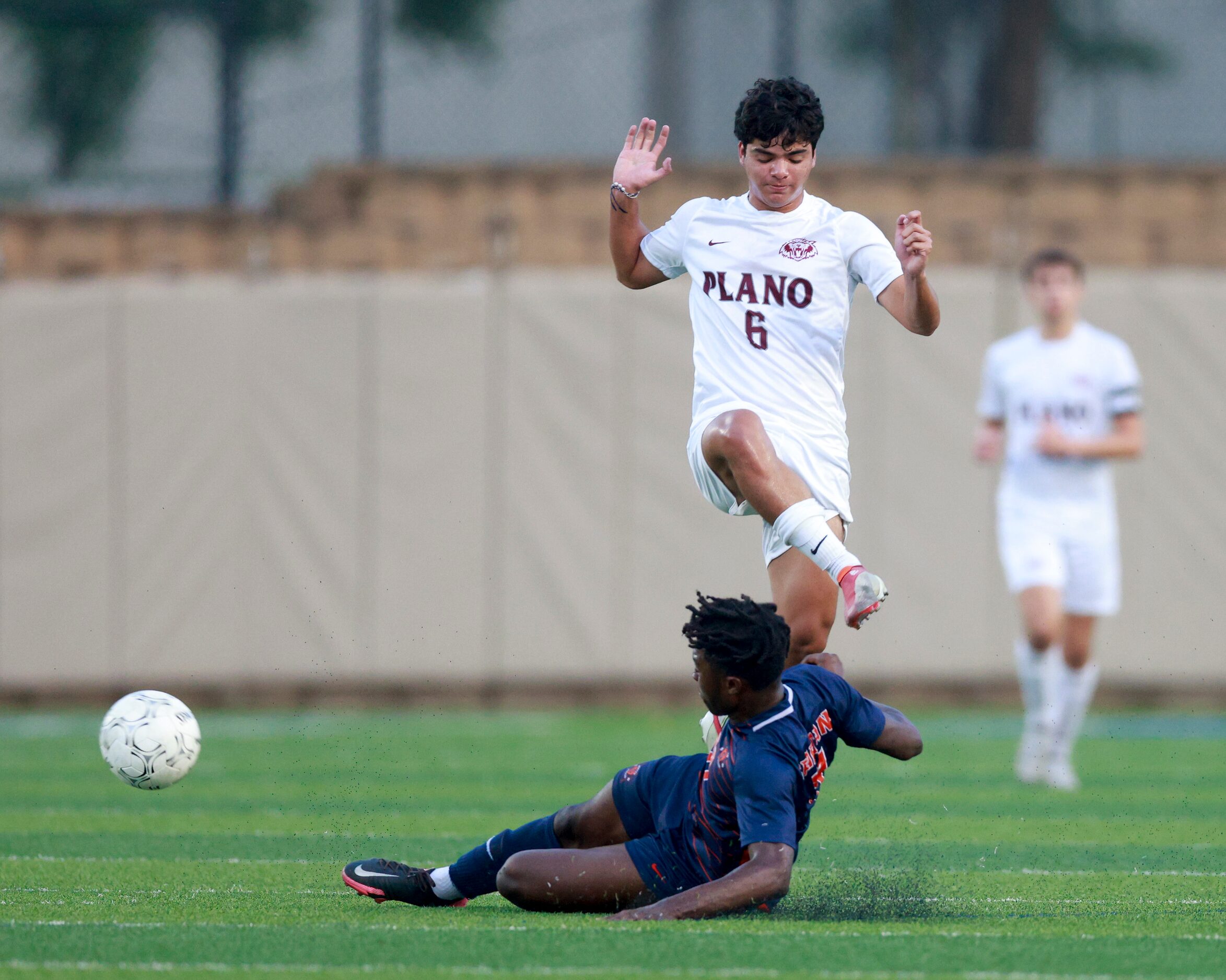 Katy Seven Lakes forward Daniel Ejerenwa (11) tackles the ball away from Plano midfielder...