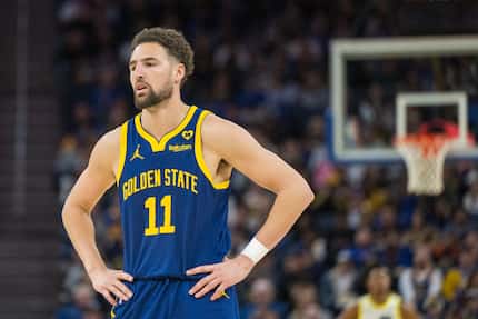 Golden State Warriors guard Klay Thompson reacts during the second half of an NBA basketball...