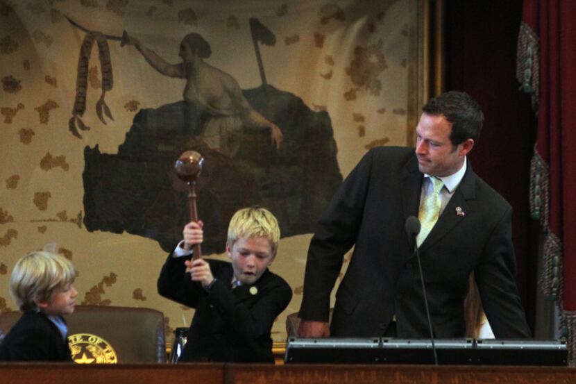 Ten-year-old Aidan Isaac wielded the gavel for his dad, state Rep. Jason Isaac, R-Dripping...
