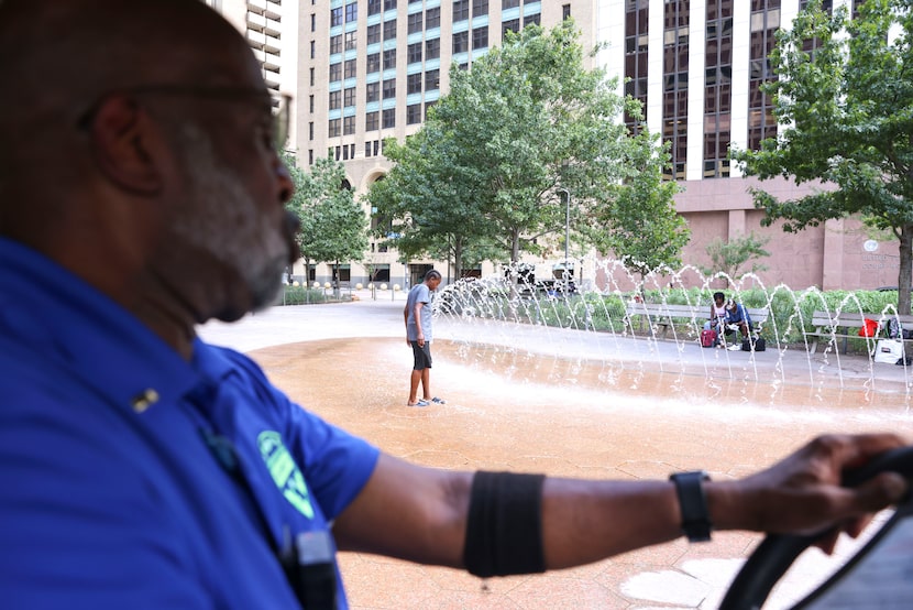 James Hosey, fields operation assistant manager of  Downtown Dallas Inc., stops by Civic...