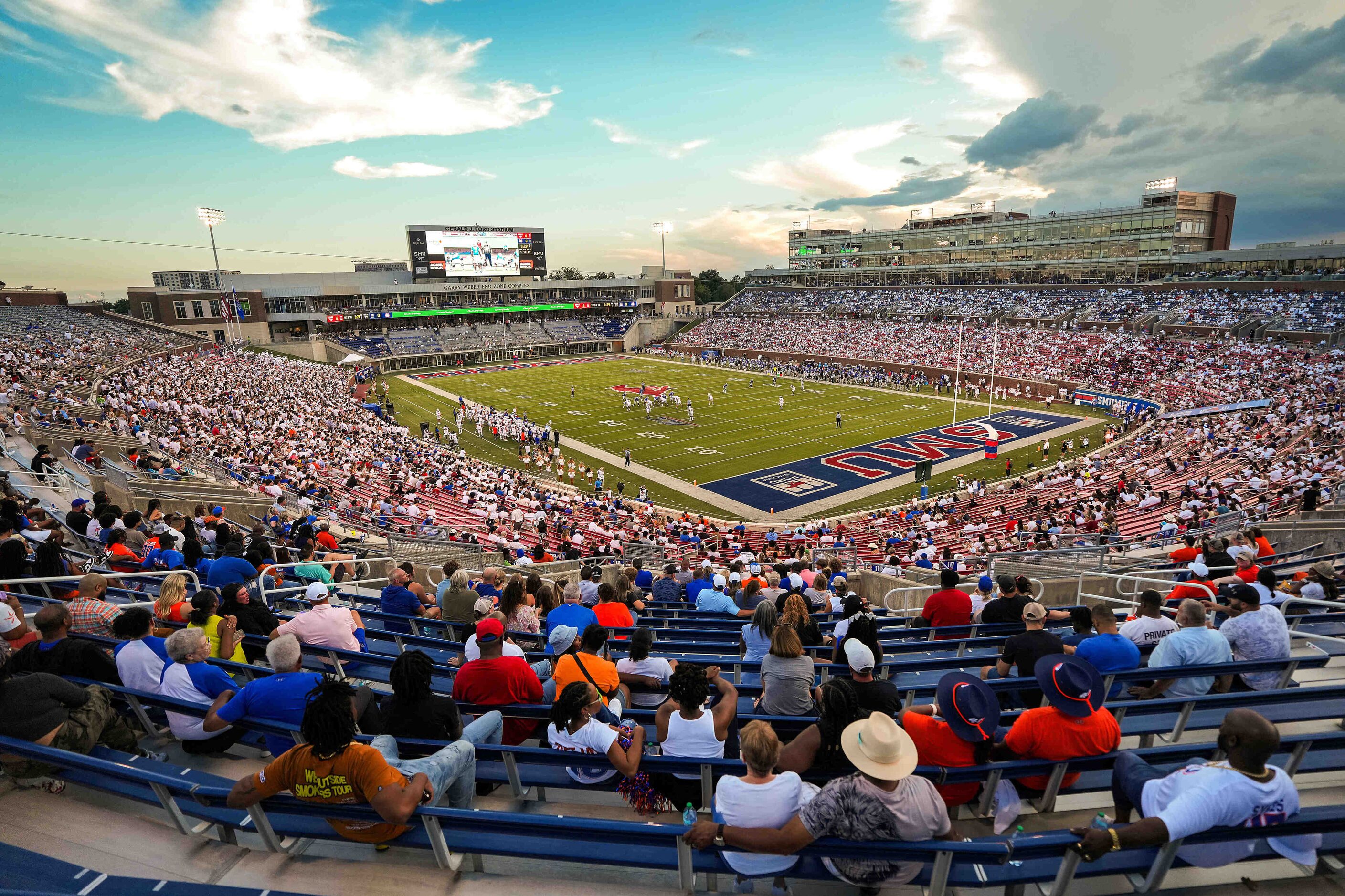 Fans watch SMU face Houston Christian during the first half of an NCAA football game at Ford...