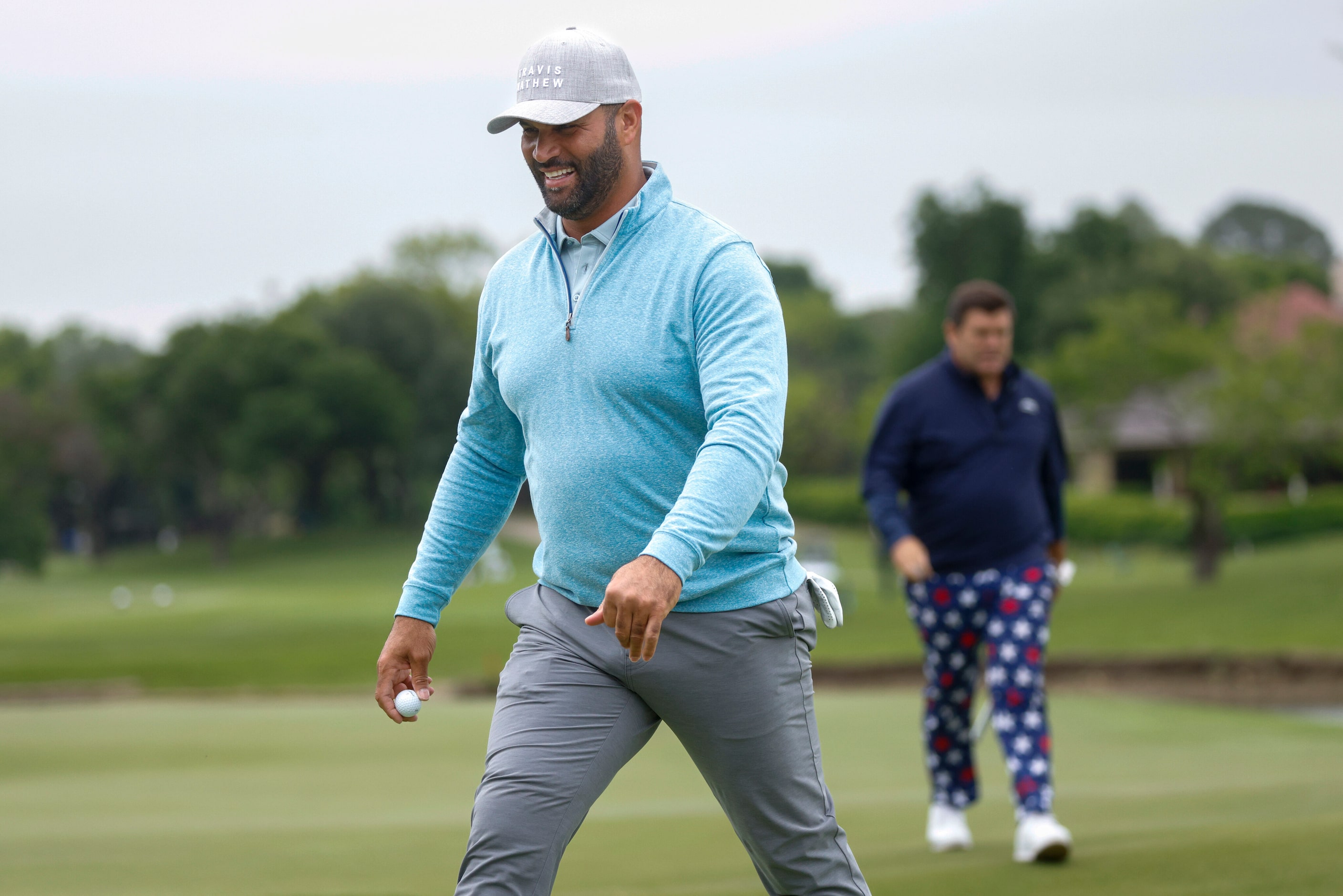 Former MLB player Albert Pujols smiles after completing the first round of the Invited...