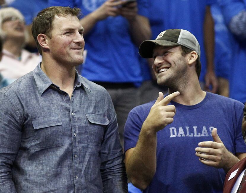 Dallas Cowboys Jason Witten, left, and Tony Romo watched the Dallas Mavericks and San...