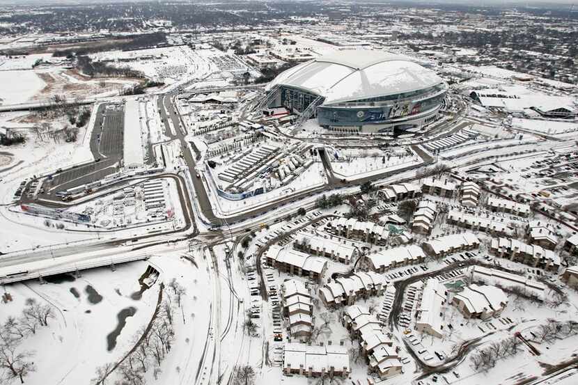  Cowboys Stadium and the surrounding area are seen blanketed by snow and ice, Friday, Feb....