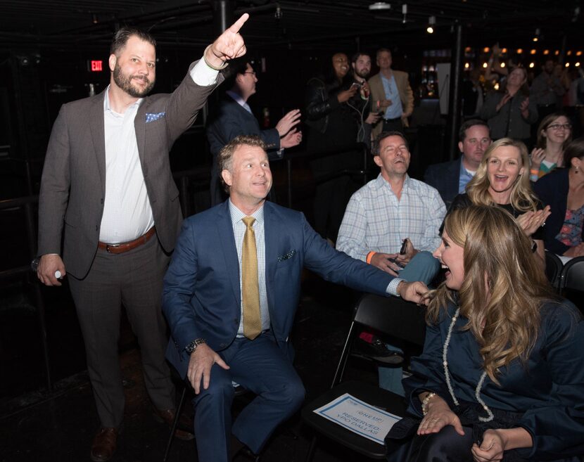 Cafe Momentum founder Chad Houser, left, and Bonton Farms creator Daron Babcock react after...