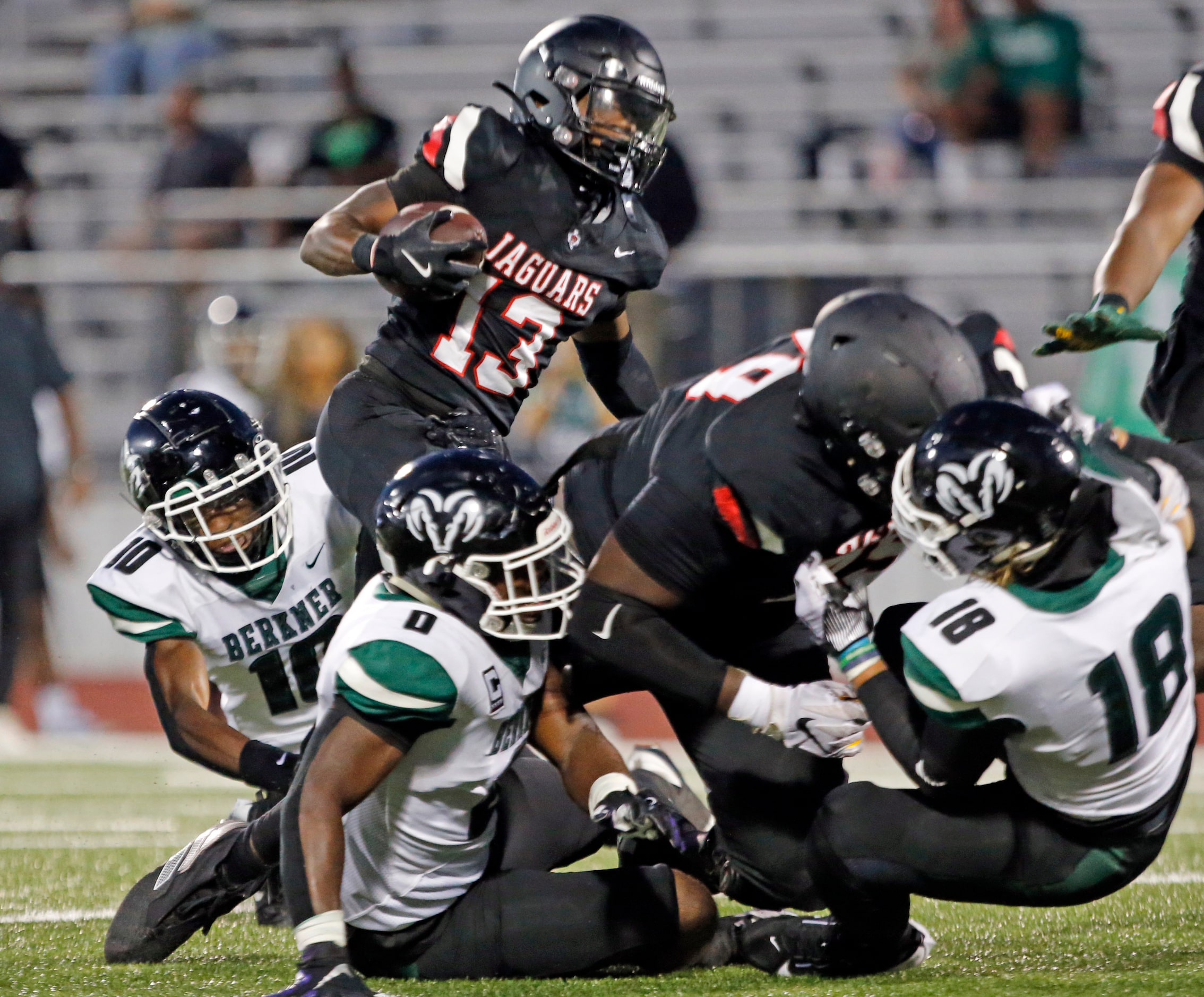 Mesquite Horn Rodney Franklin (13) tries to carry the football through the Richardson...