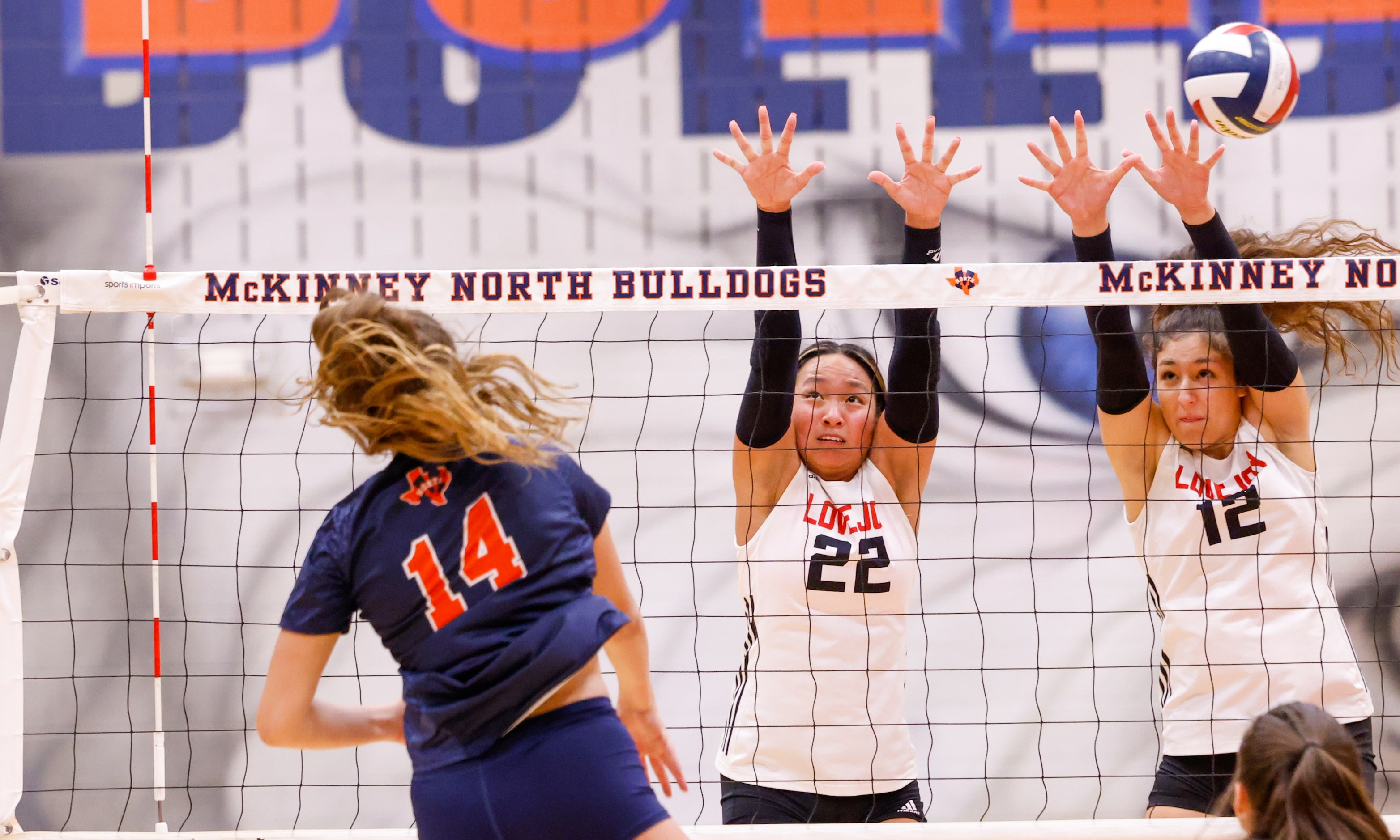 Lovejoy Bethanie Wu (22) and Hannah Gonzalez (12) jump to block a spike by McKinney North...