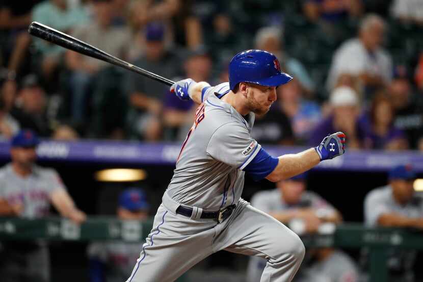 New York Mets' Todd Frazier watches his RBI single off Colorado Rockies pitcher Rico Garcia...