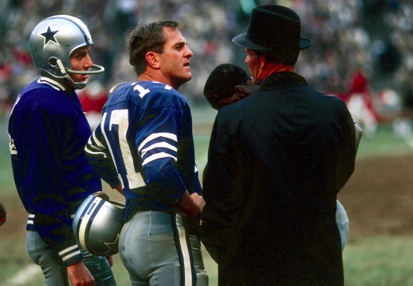 Dallas Cowboys quarterback #17 Don Meredith on the sidelines with head coach Tom Landry...