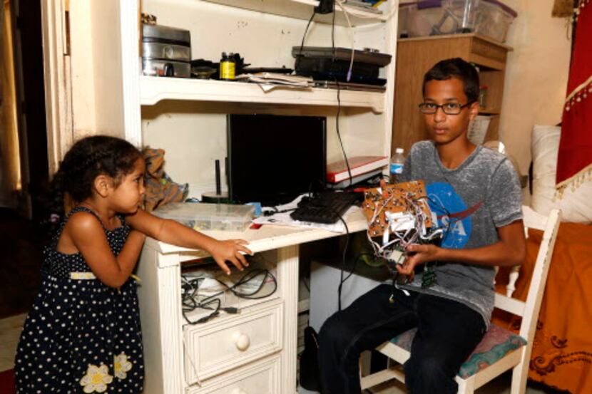 
Ahmed Mohamed, 14, posed with some of his other electronics in his room with his sister,...