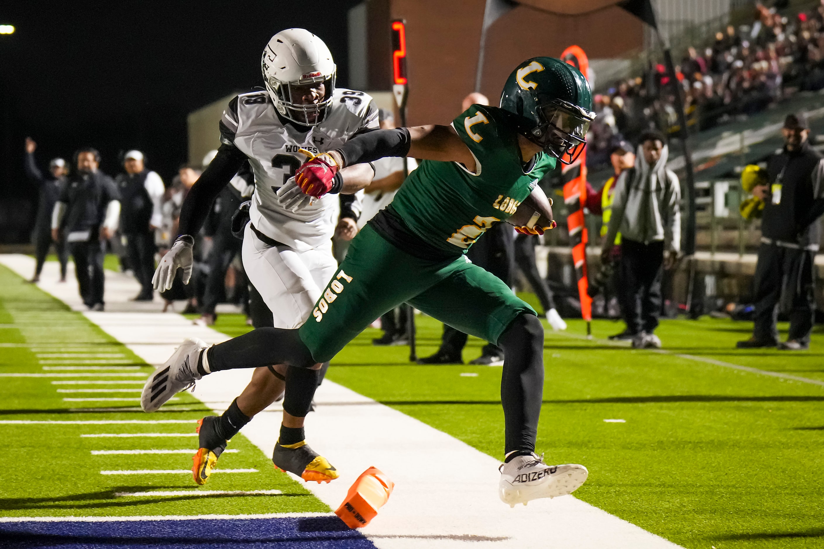 Longview running back  Taylor Tatum gets past Mansfield Timberview linebacker Kingsley Opara...