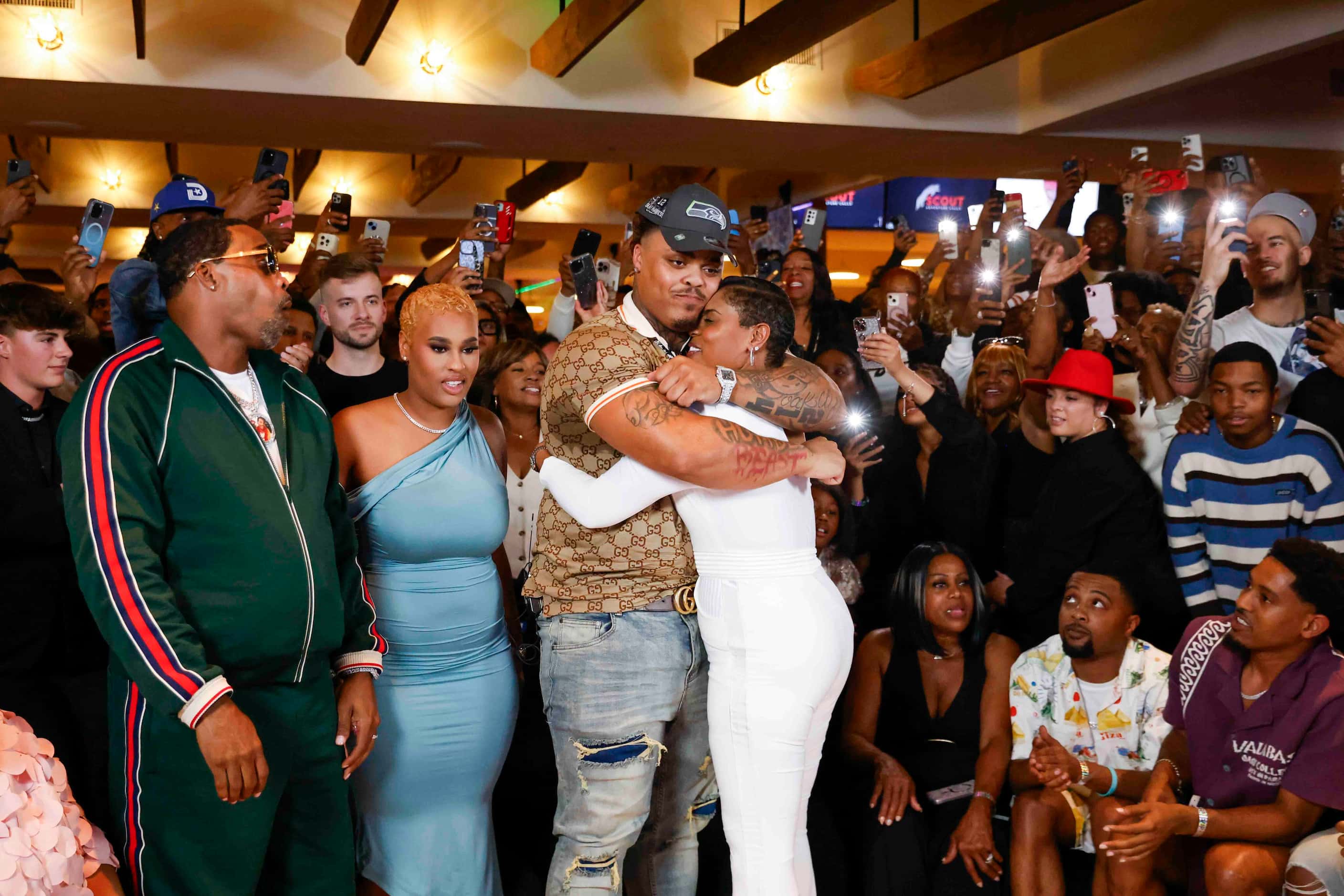 Texas defensive tackle Byron Murphy II, (left) from DeSoto, hugs his mother his mother,...