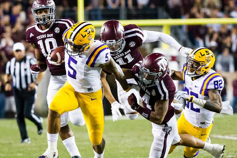 LSU running back Derrius Guice (5) breaks through the Texas A&M defense on a 45-yard...