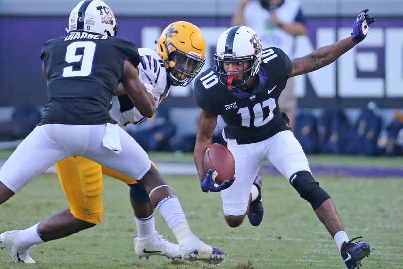 TCU Horned Frogs wide receiver Desmon White (10) runs for yardage after the catch as...