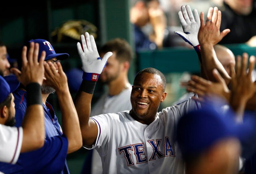 Texas Rangers third baseman Adrian Beltre (29) celebrates with teammates after hitting a...