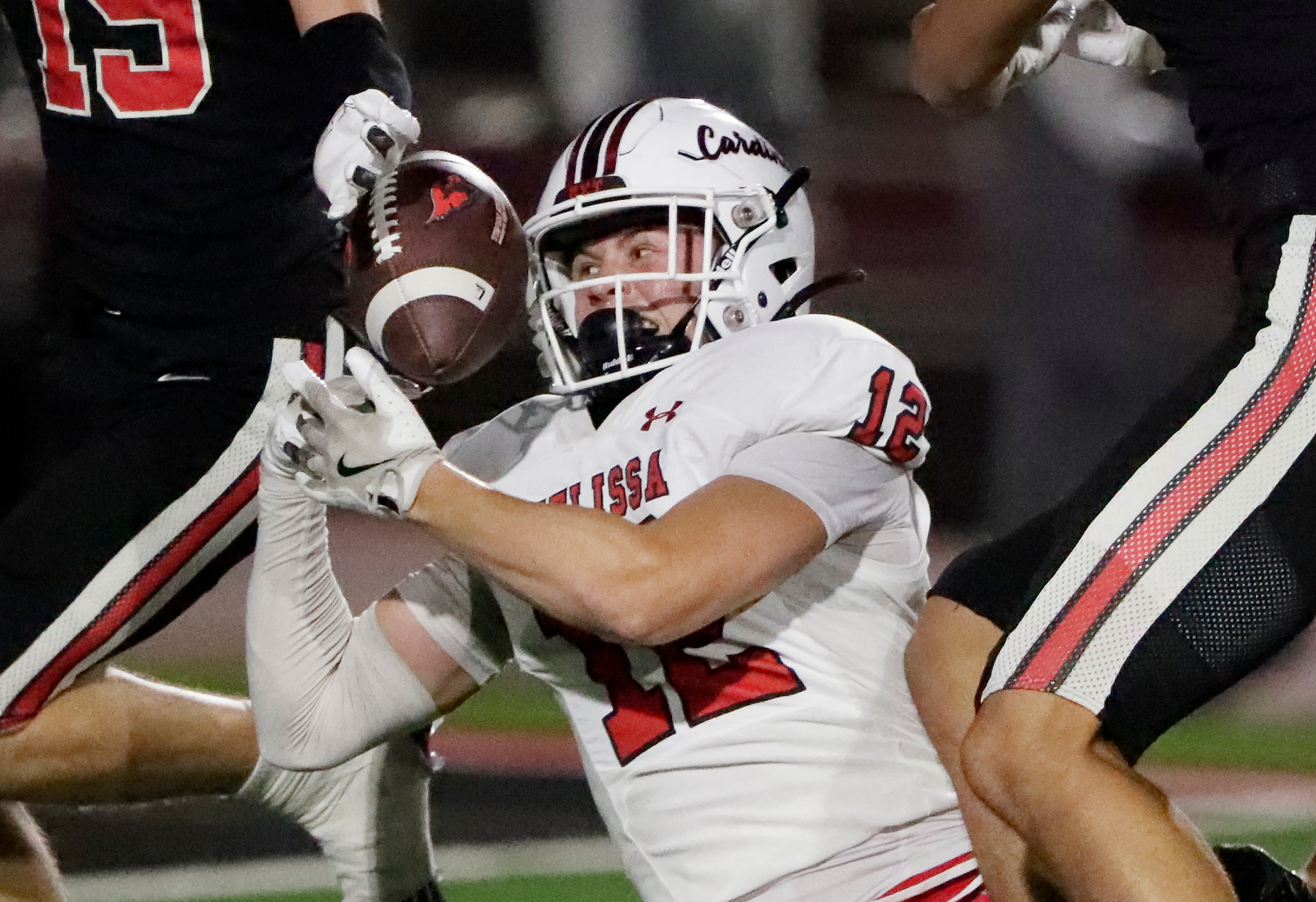 Melissa High School wide receiver Tyler Montgomery (12) was unable to hang on for the catch...