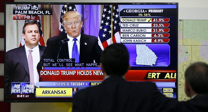 Supporters of U.S. Rep. Pete Sessions, R-Dallas, watch Donald Trump's press conference on...