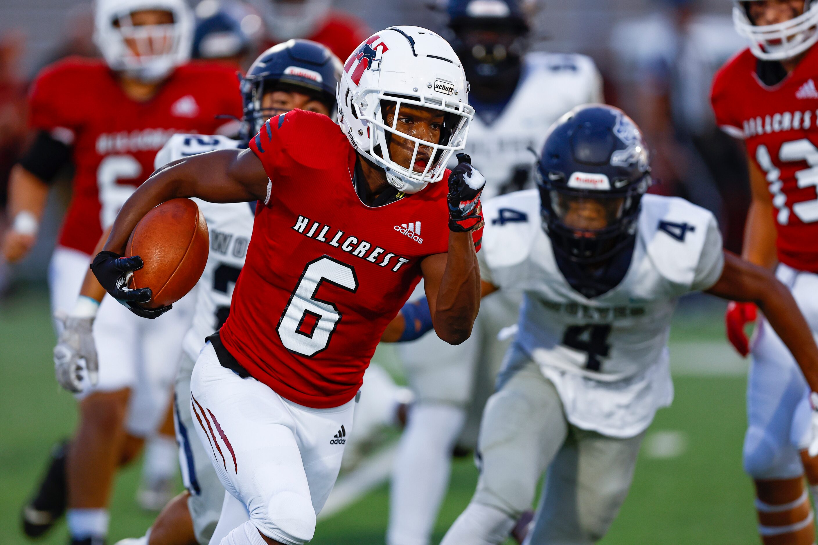 Hillcrest senior running back Jaden Hodge (6) looks for room against the Carrollton...