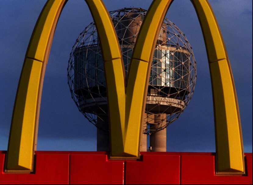 Two icons converge: the Reunion Tower ball and a set of McDonald's golden arches, in 1996.