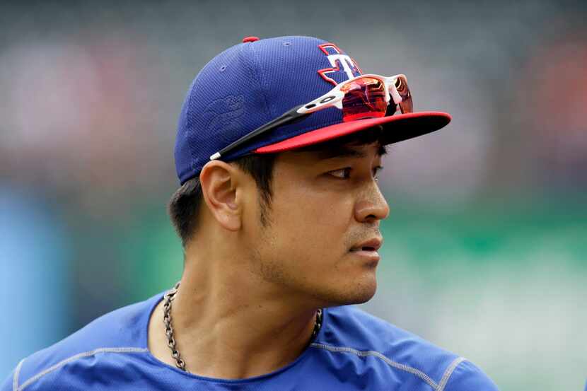 Texas Rangers' Shin-Soo Choo, of South Korea, walks on on the field during batting practice...