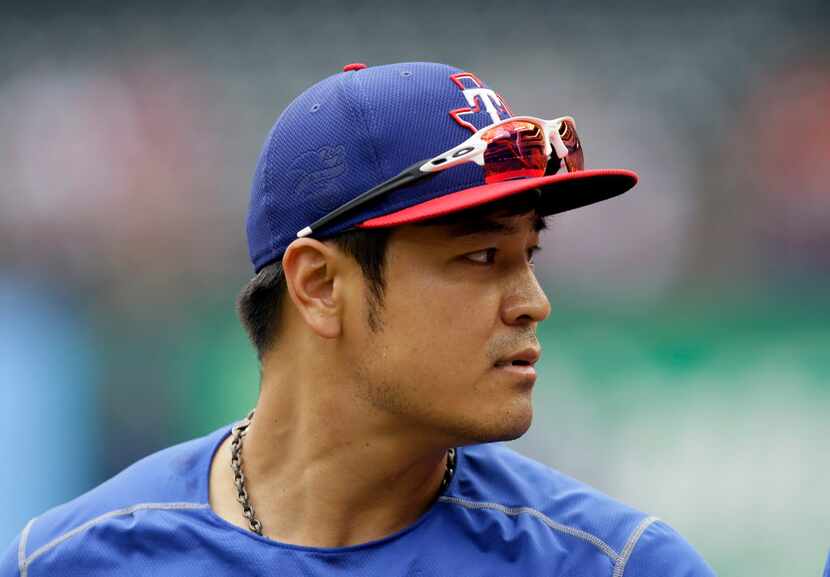 Texas Rangers' Shin-Soo Choo, of South Korea, walks on on the field during batting practice...