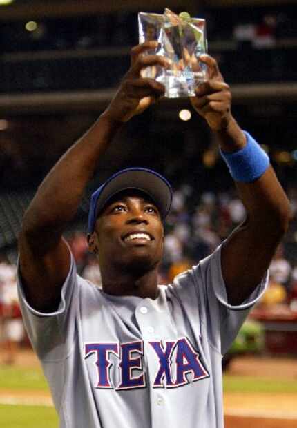 7-13-04 --  Texas' Alfonso Soriano displays the MVP trophy after the AL's 9-4 win over the...