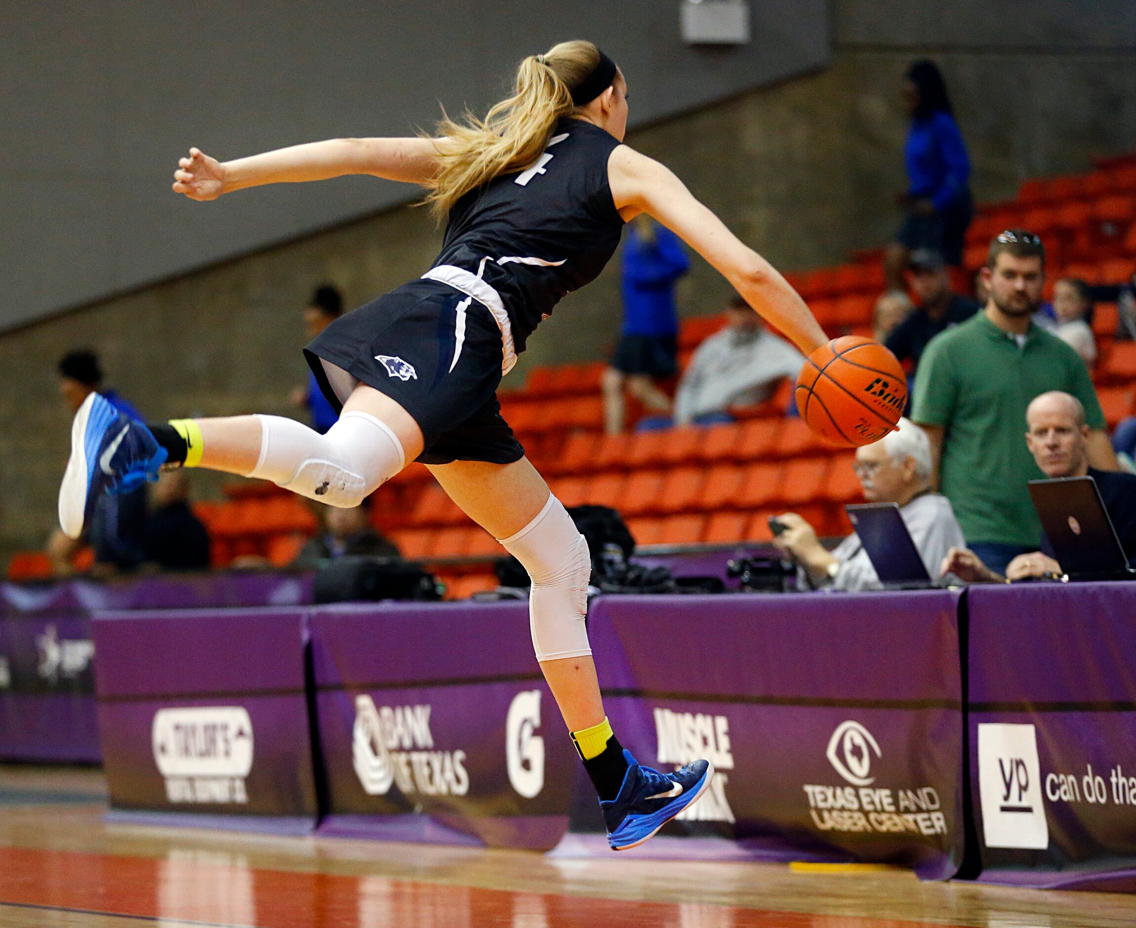 Flower Mound center Lauren Cox (44) tries to save a loose ball from going out of bounds...