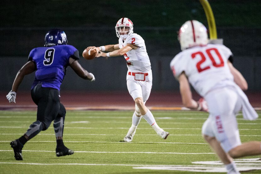 Grapevine Faith quarterback Deuce Hogan (2) prepares to throw to wide receiver Hilton Harris...