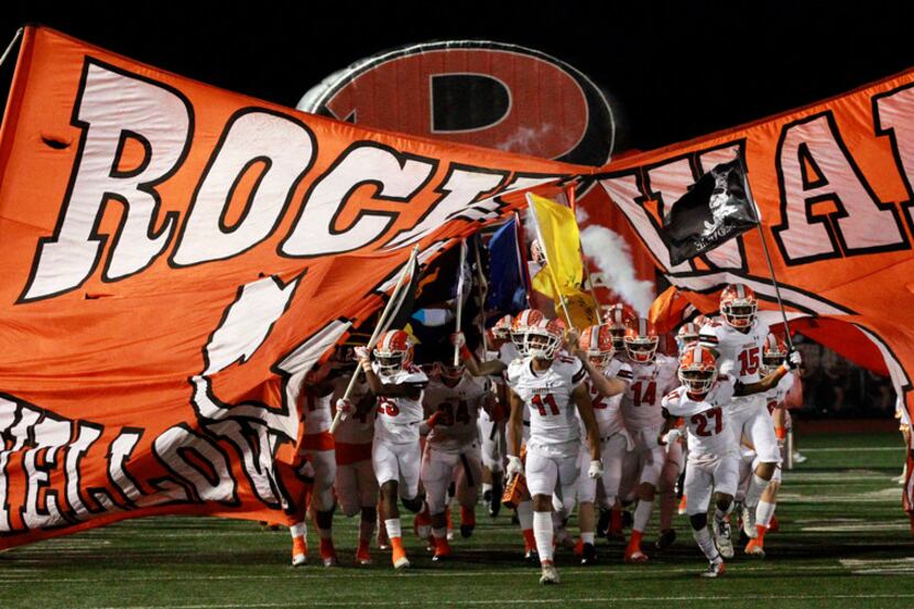 The Rockwall Yellowjackets take the field before the start of the the Class 6A Division I...