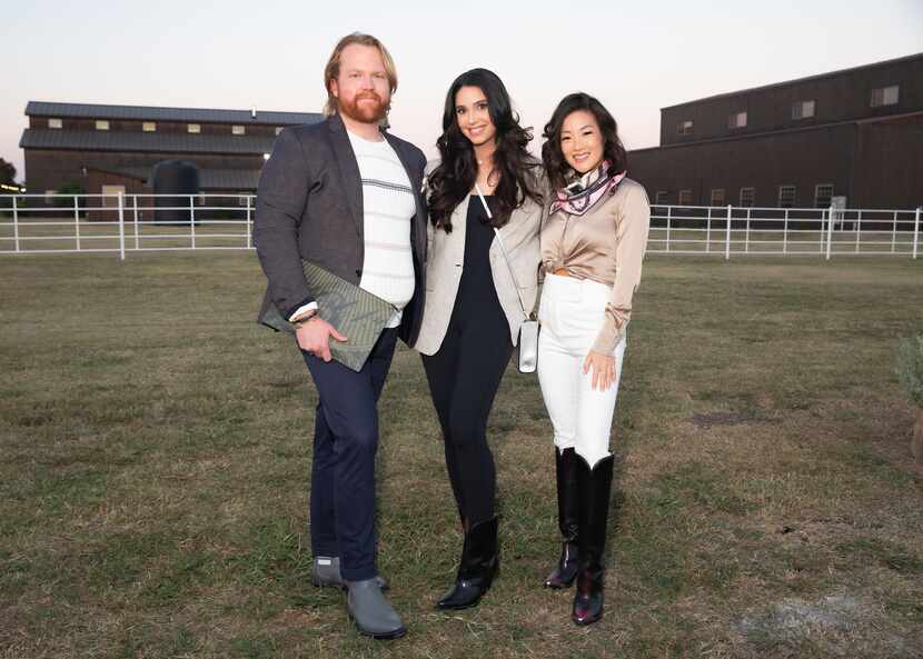 Neiman Marcus personal stylist Chase Cavin, left, is shown with Neiman Marcus customers...