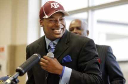  Skyline High wide receiver Thomas Johnson flashes a big smile, after he signed his National...