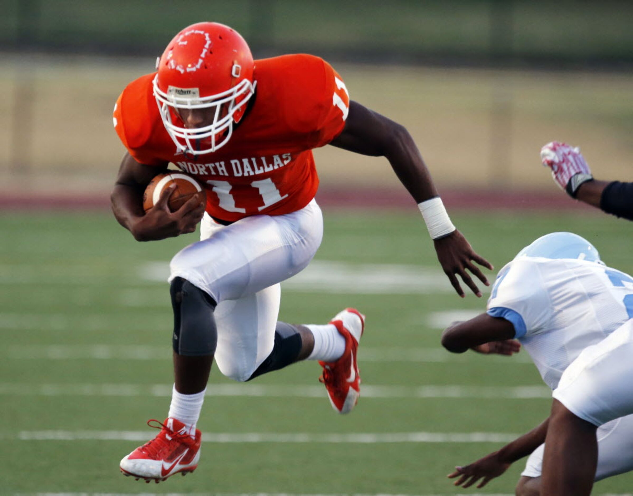 (TXHSFB) Noth Dallas RB Geovoni Manning (11) picks up a first down during the first half of...