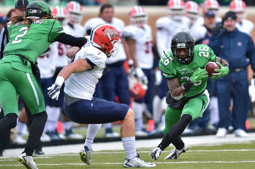 North Texas sophomore running back Jeffrey Wilson (26) looks for room to run after a catch...