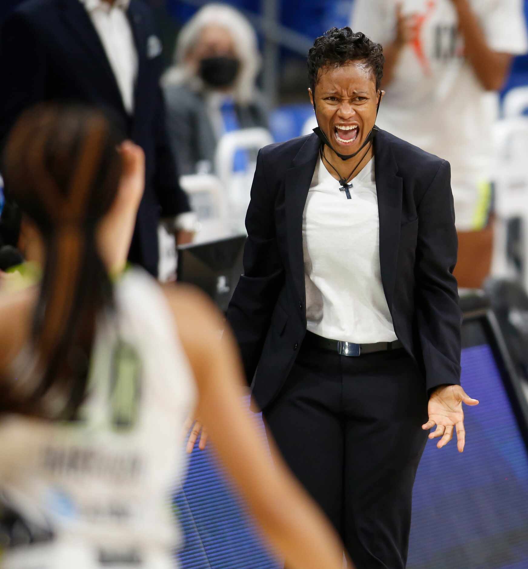 Dallas Wings head coach Vickie Johnson reacts to the outcome of a defensive play during the...