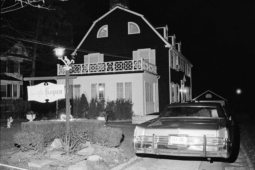 On Nov. 14, 1974, police and members of the Suffolk County Coroner's Office investigate the...