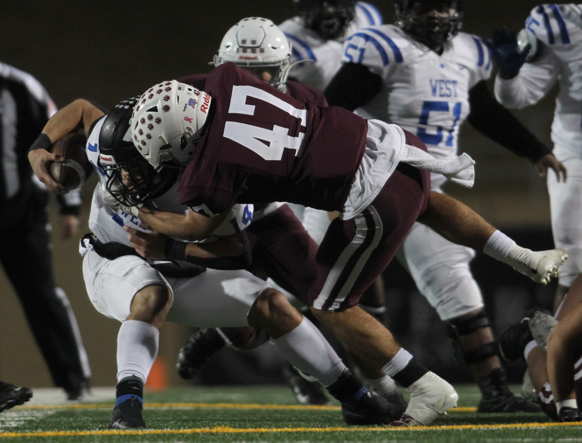 Plano defensive lineman Anthony Spiotti (47) storms into the Wolves backfield to sack Plano...