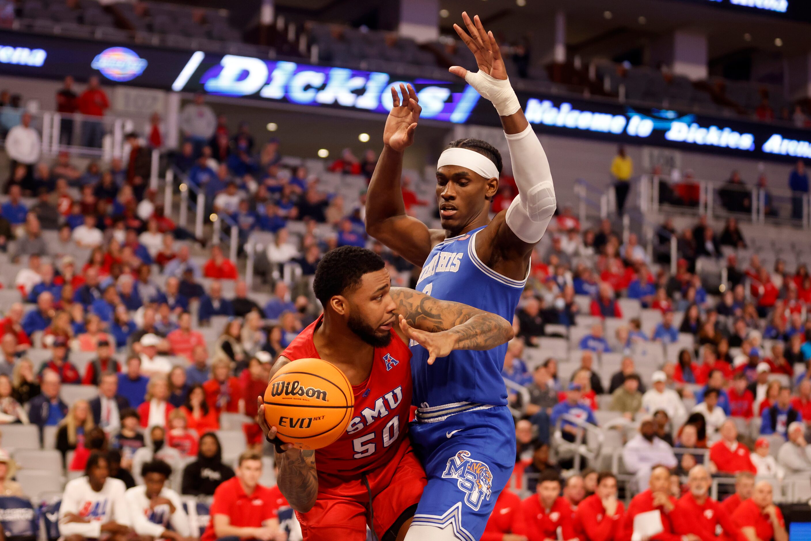 SMU forward Marcus Weathers (50) tries to get the ball past Memphis center Jalen Duren (2)...