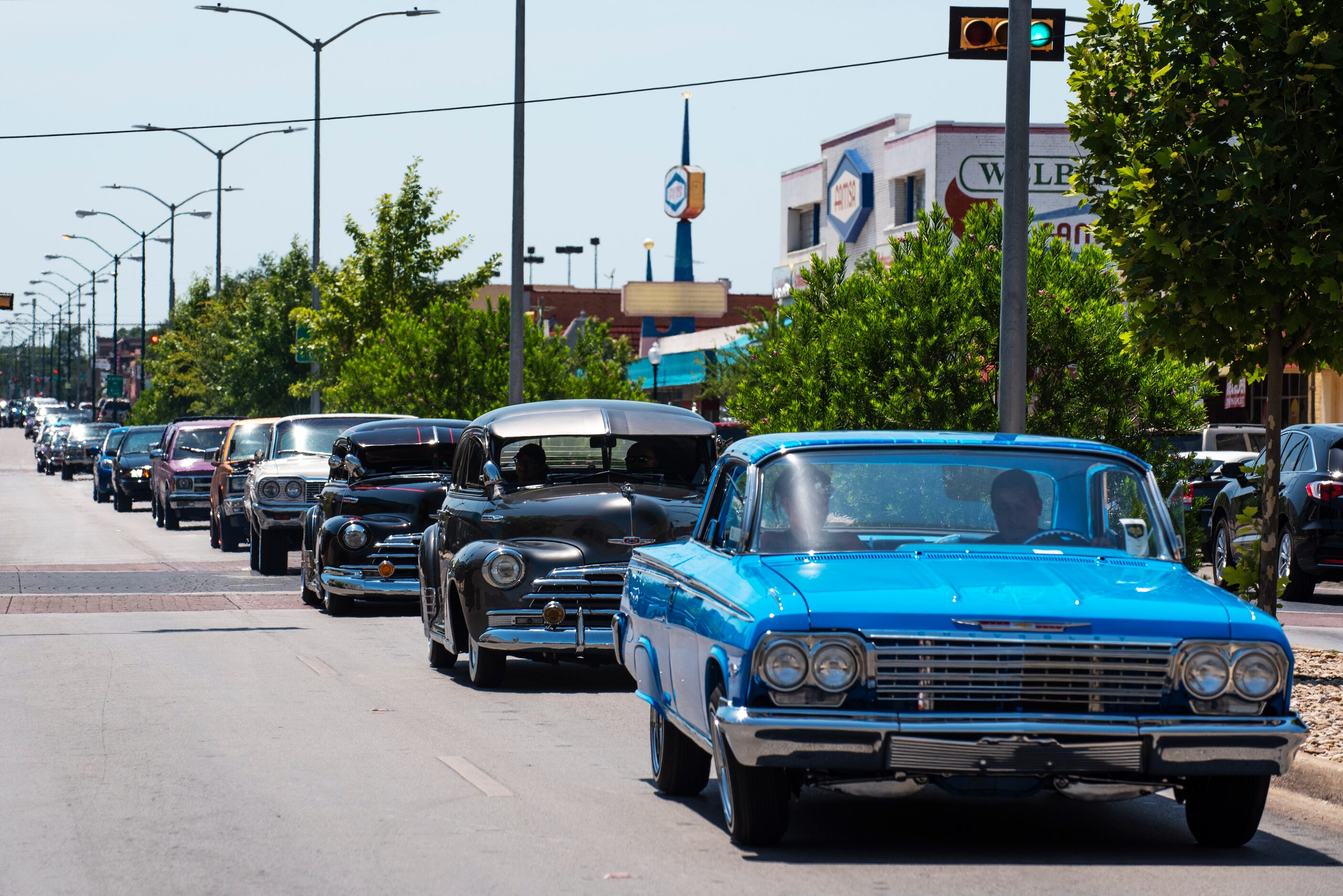 Lowriders from the United Lowriders Association cruise along Jefferson Boulevard as they...