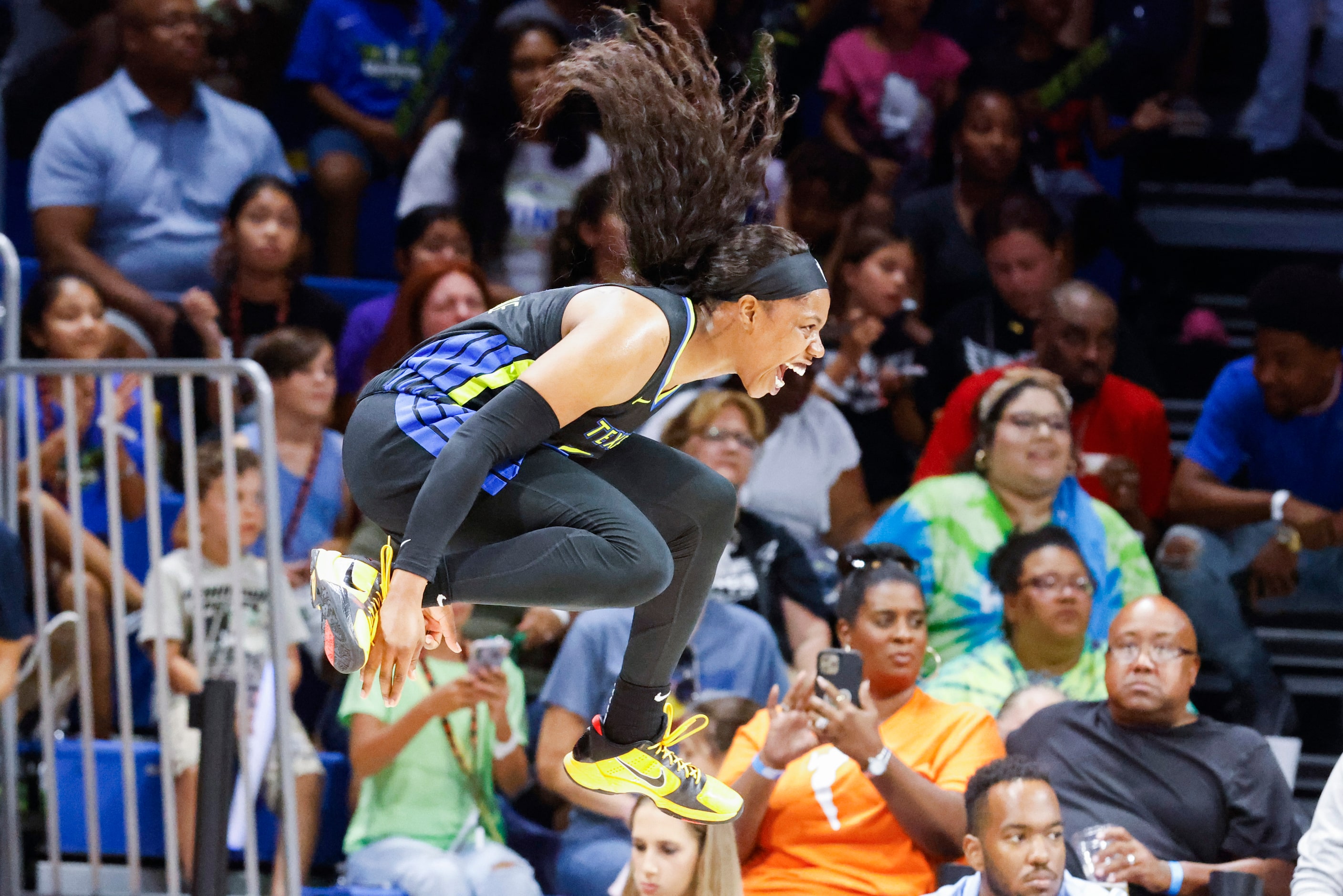 Dallas Wings guard Arike Ogunbowale reacts out of frustration after no foul called against...