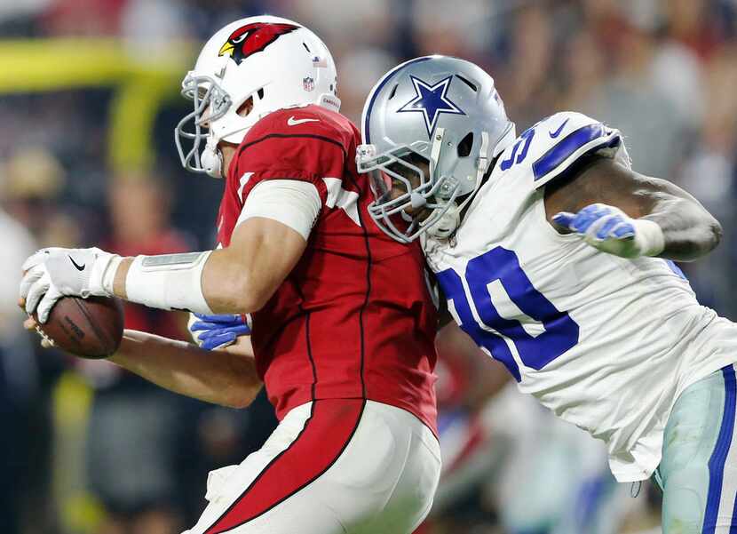 Dallas Cowboys defensive end Demarcus Lawrence (90) sacks Arizona Cardinals quarterback...