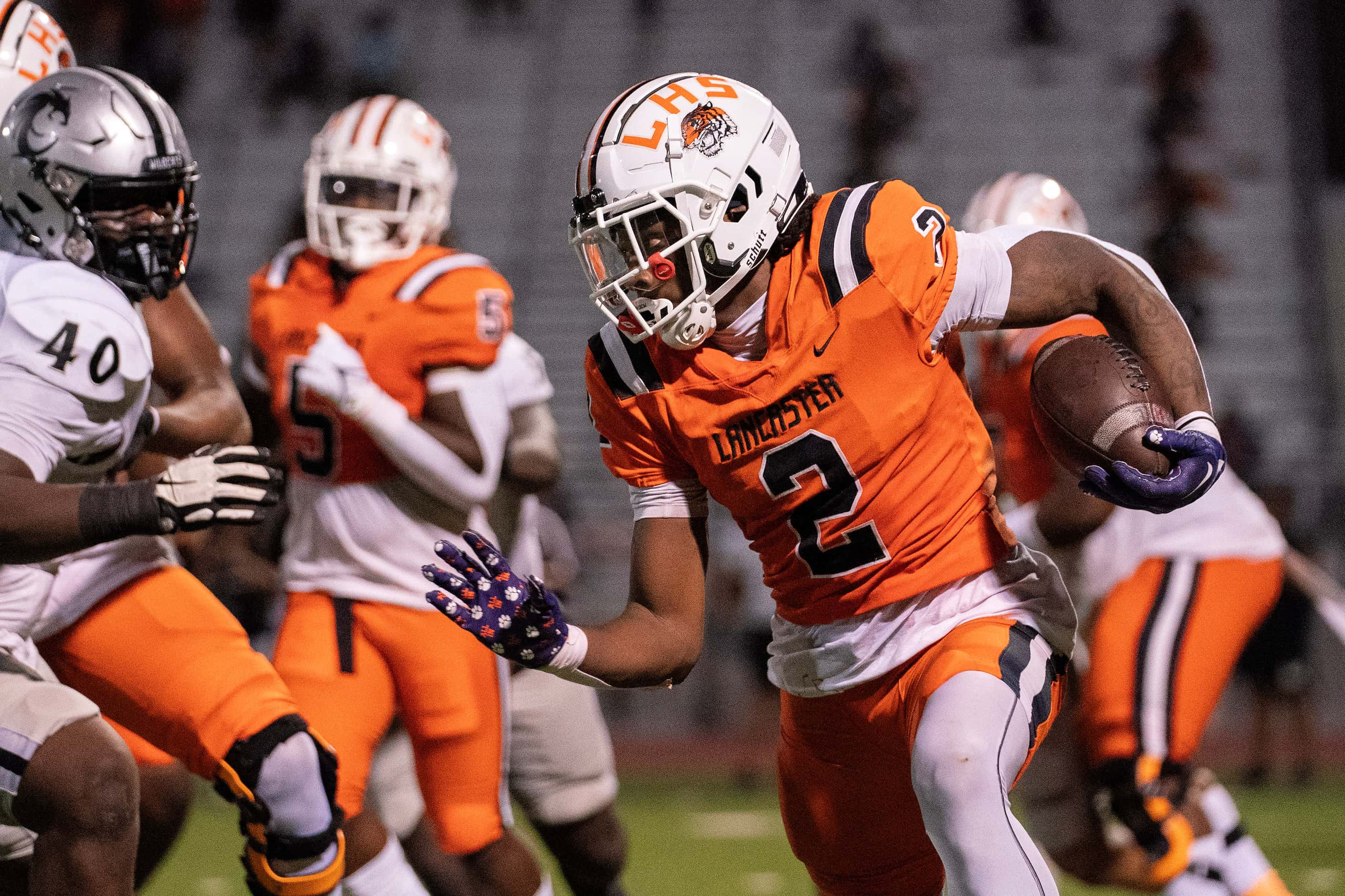 Lancaster senior running back Kewan Lacy (2) turns upfield during the first half of a high...