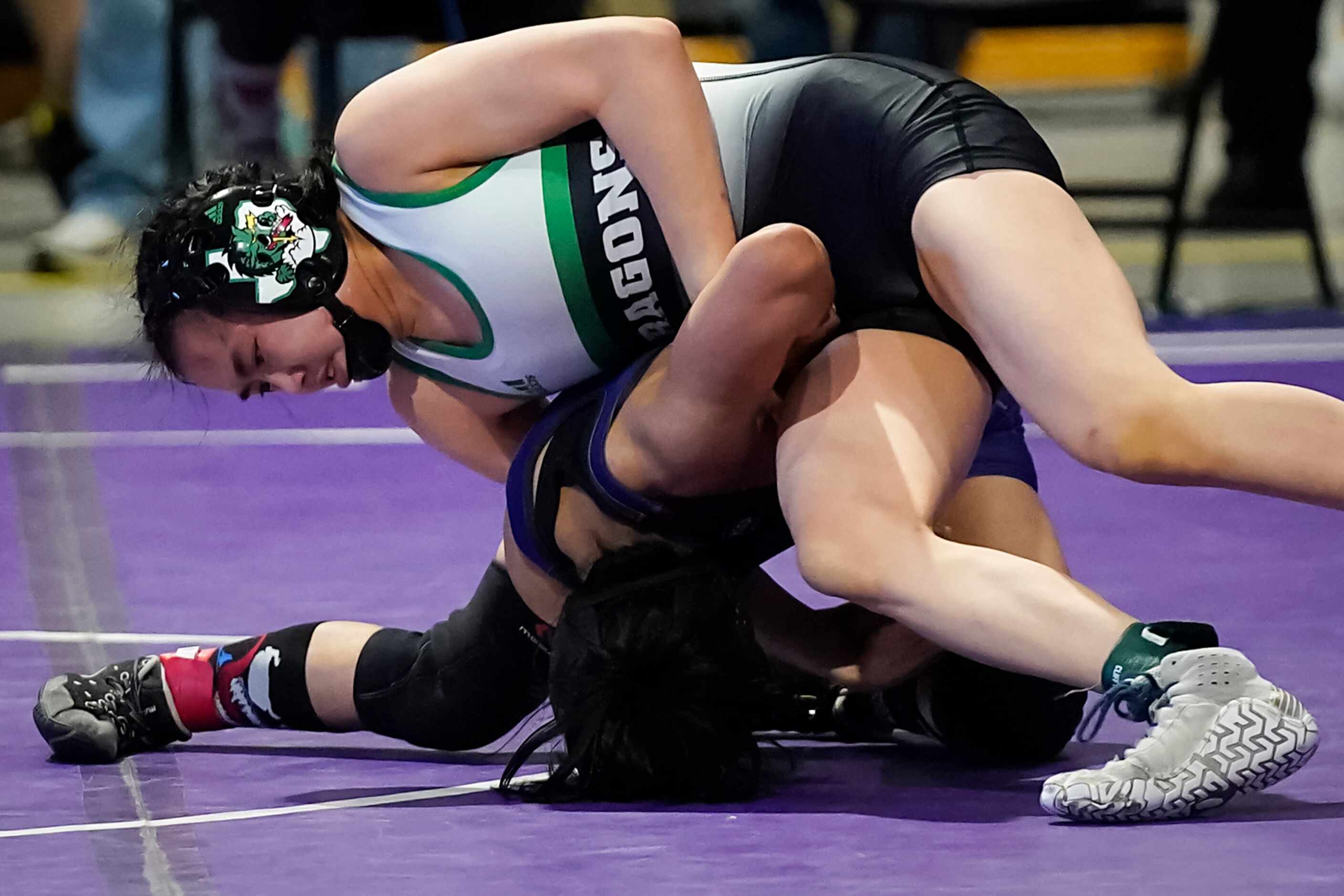 Bayley Trang of Southlake Carroll wrestles Brittany Cotter of Katy Morton Ranch for the 6A...