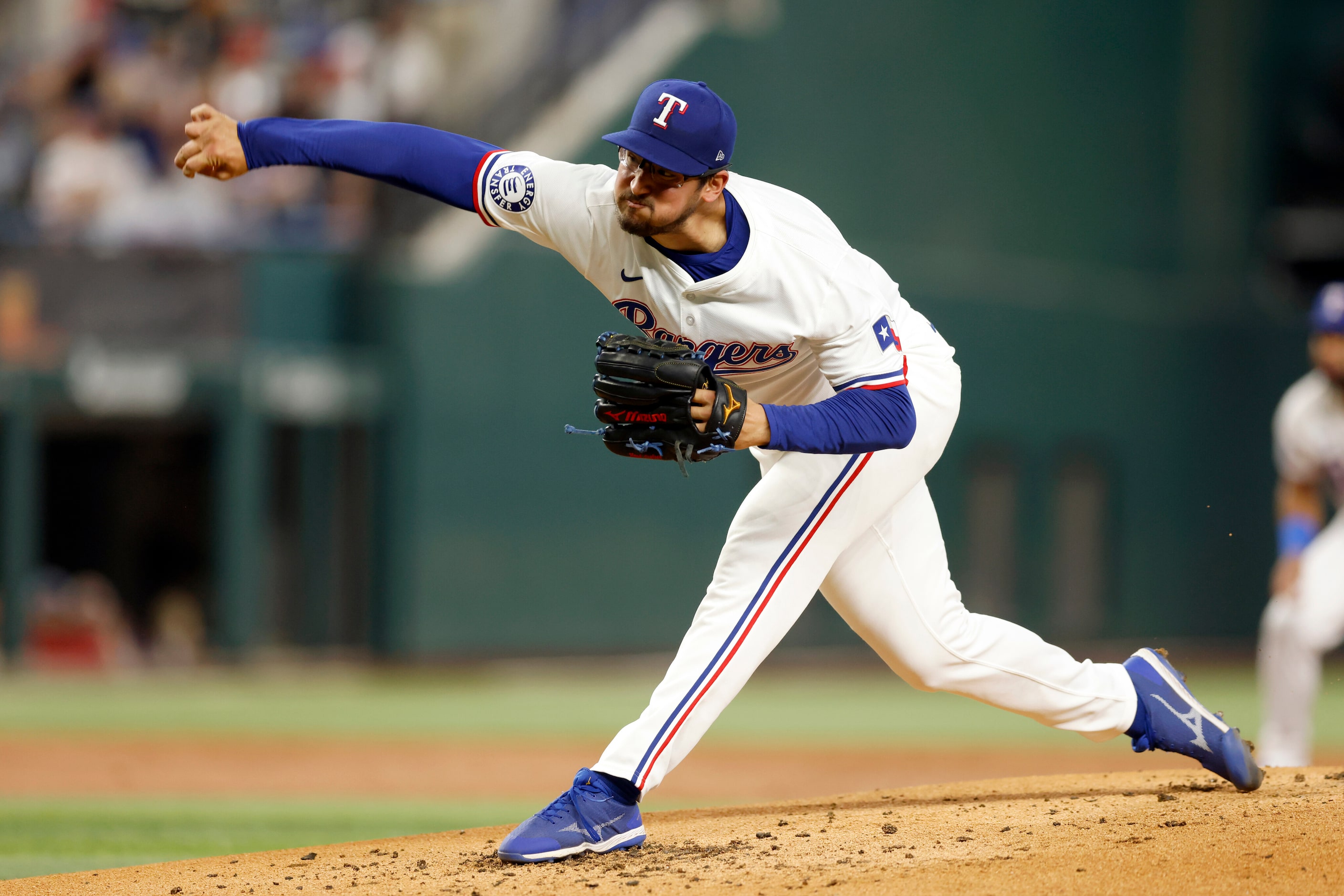 Texas Rangers starting pitcher Dane Dunning (33) delivers a pitch during the second inning...